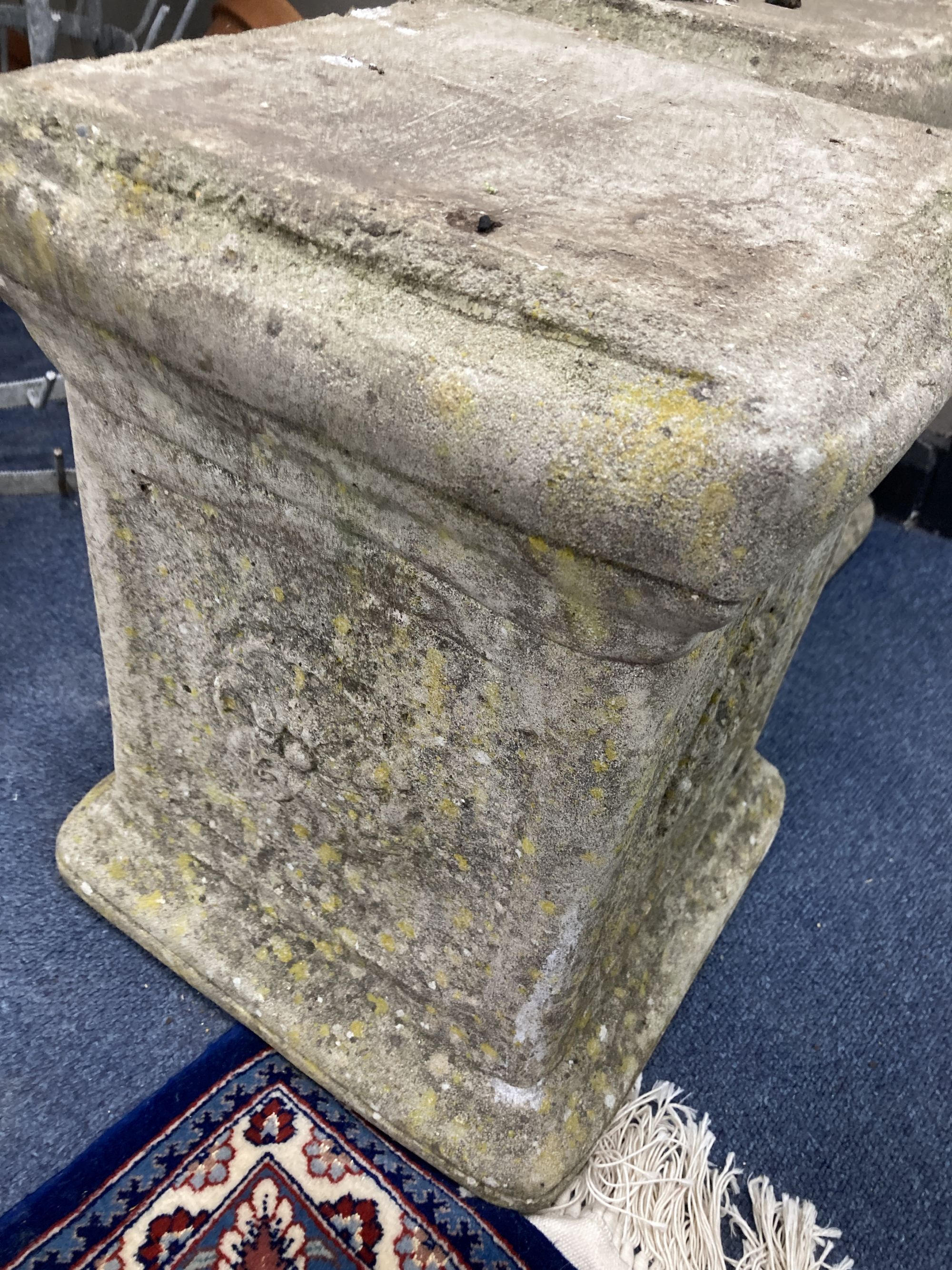 A pair of reconstituted stone plinths, height 39cm